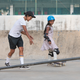 Atita Verghese offers instruction to young skateboarder Vidya Das.